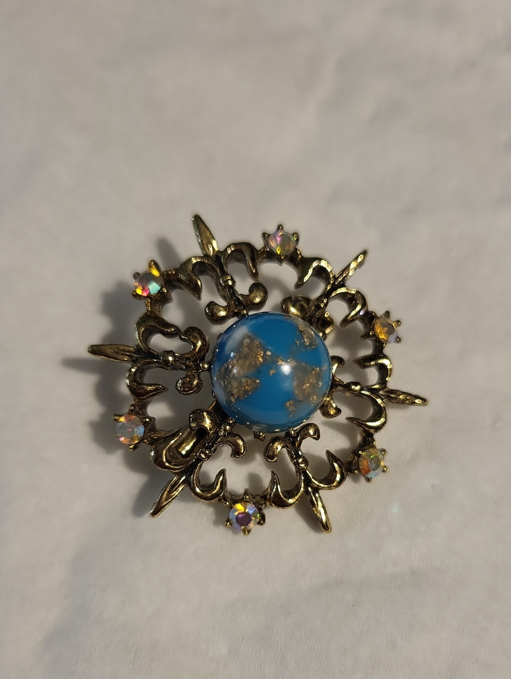Vintage Gold-Tone Blue Cabochon Floral Brooch with Aurora Rhinestones